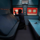 An Indian Railways employee works to convert a train coach into an isolation ward.